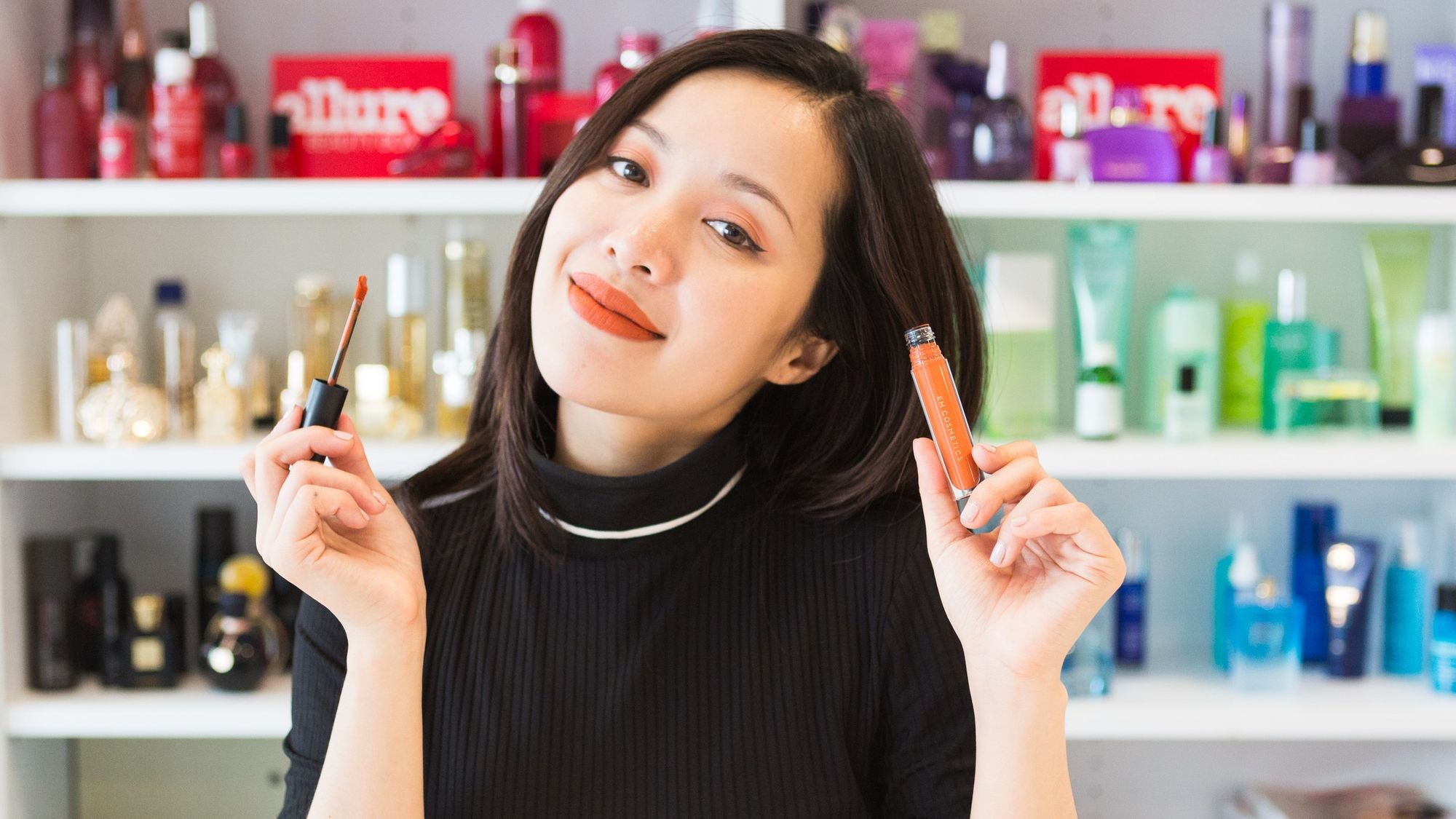 Michelle Phan showing her own beauty brand EM Cosmetics.